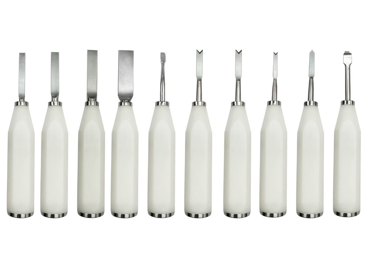 A set of white plastic tools on a white background.