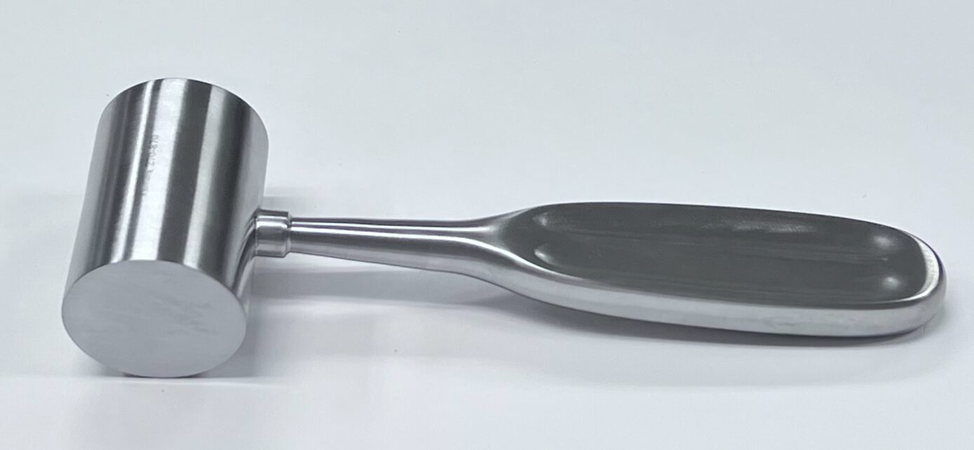 A stainless steel MALLET, KIRK on a white surface.