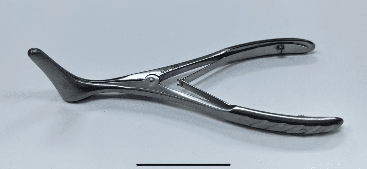 A pair of VIENNA NASAL SPECULUMS on a white surface.