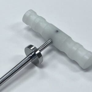 A RETROGRADE CEMENT CHISEL with a metal handle on a white surface.