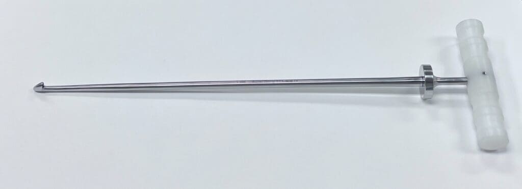 A RETROGRADE CEMENT CHISEL handle on a white surface.