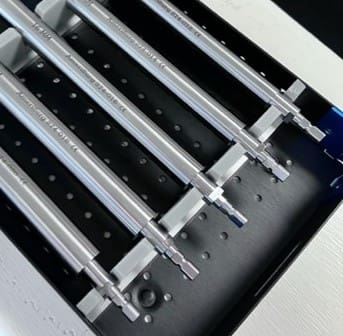 A set of ORTHOPEDIC TREPHINE in a box on top of a table.