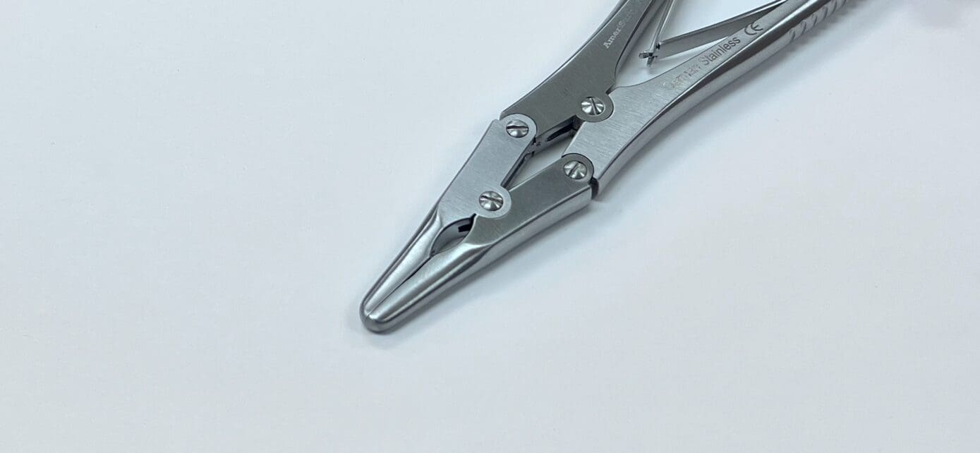 A pair of RUSKIN BONE RONGEUR on a white surface.