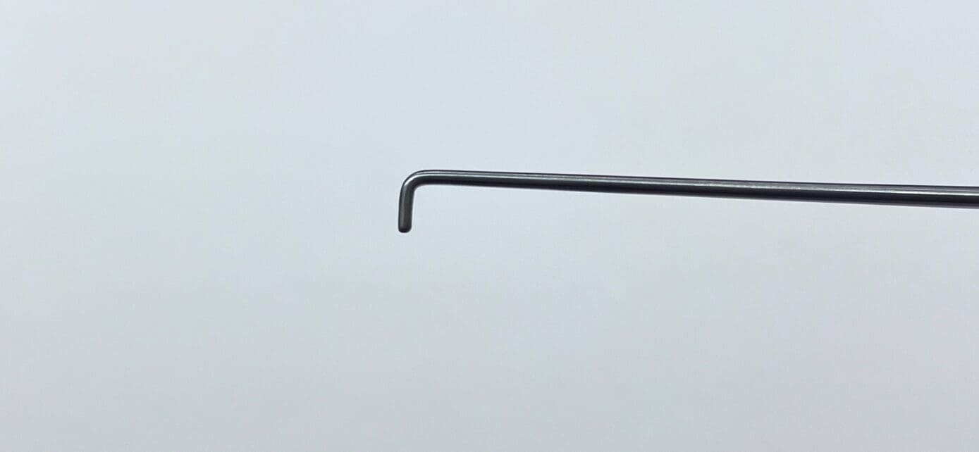 A metal rod with a DANDY NERVE HOOK attached to it.