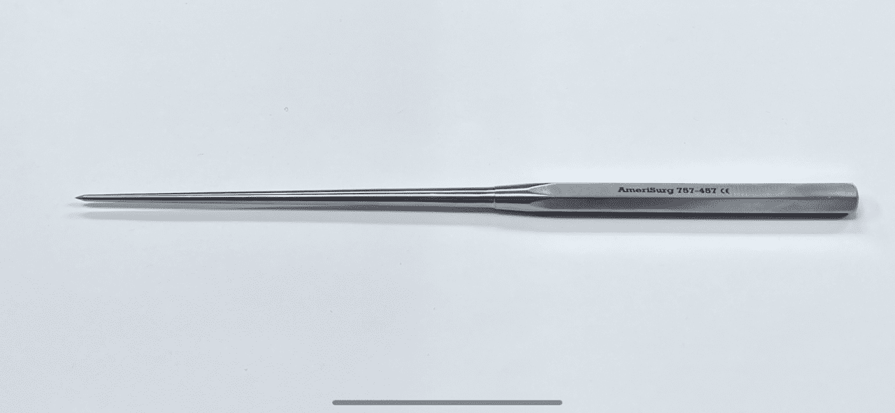 A stainless steel SPINAL AWL with a handle on a white surface.