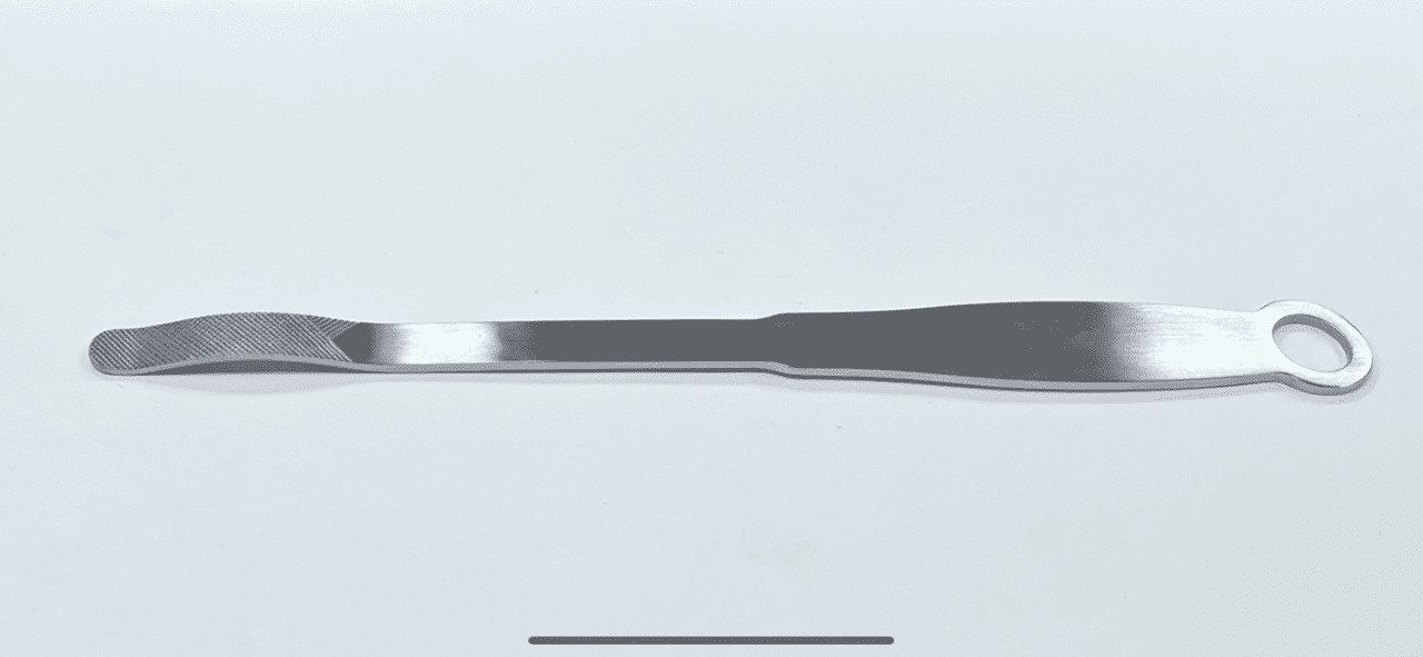 A POSTERIOR GLENOID ELEVATOR with a handle on a white surface.