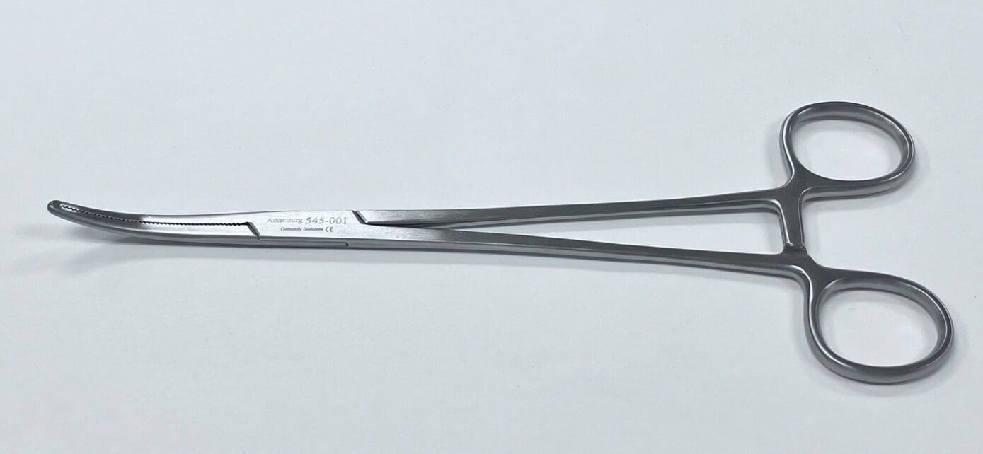 A Vanderbilt University vessel clamp on a white surface.