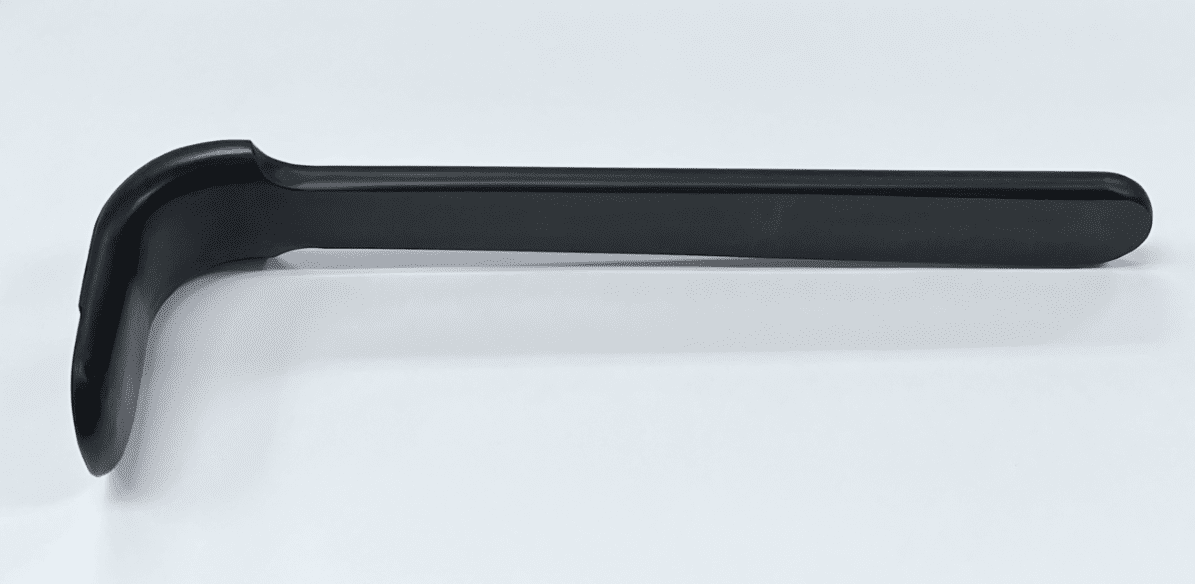 A BROWN DELTOID RETRACTOR-LARGE, RADIOLUCENT, MODIFIED plastic handle on a white surface.