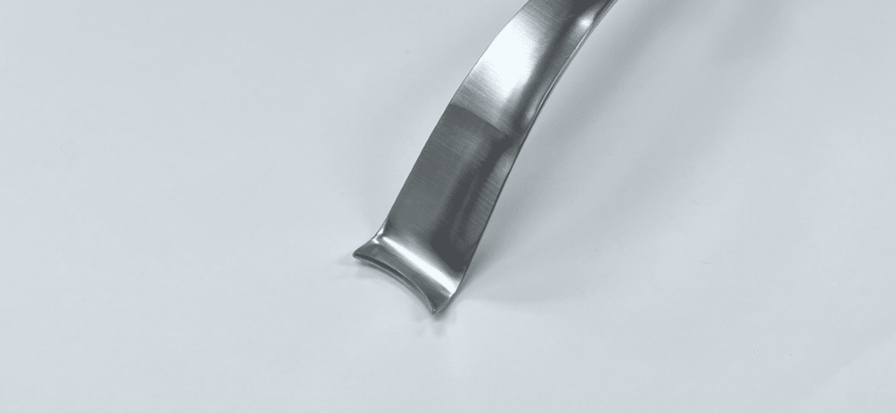 A FEMORAL NECK ELEVATOR, MUELLER, HUR TYPE on a white surface.