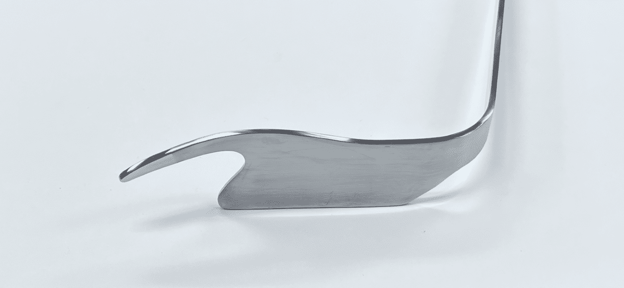 A POSTERIOR CAPSULE RETRACTOR, RIGHT, DORR TYPE with a curved handle on a white surface.