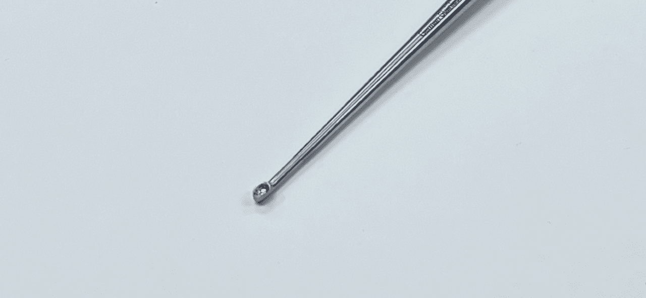 A BRUNS SPINAL FUSION CURETTE, STRAIGHT 9" is sitting on a white surface.