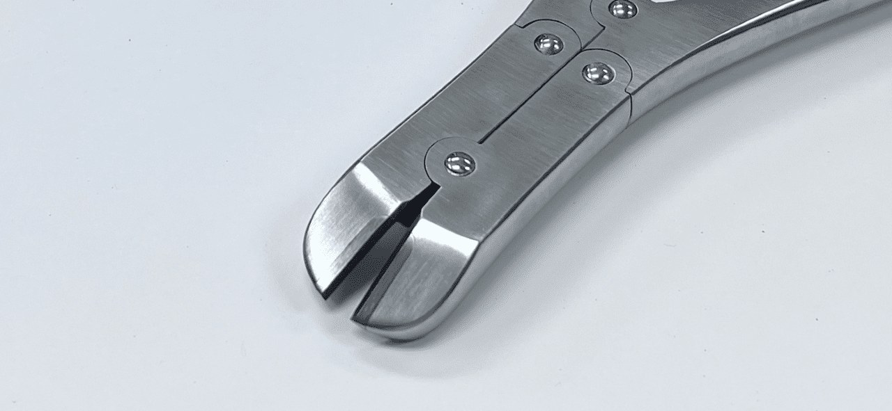 A pair of wire cutter, side cutting pliers on a white surface.