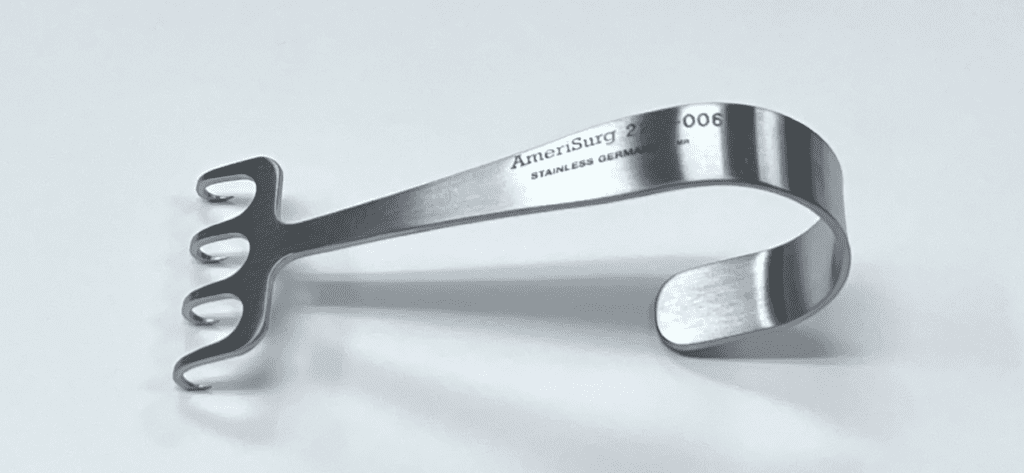 A MAXWELL FLAP RETRACTOR with a handle on it.