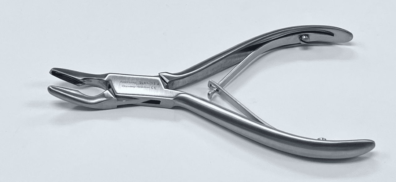 A pair of Friedman Rongeur on a white surface.