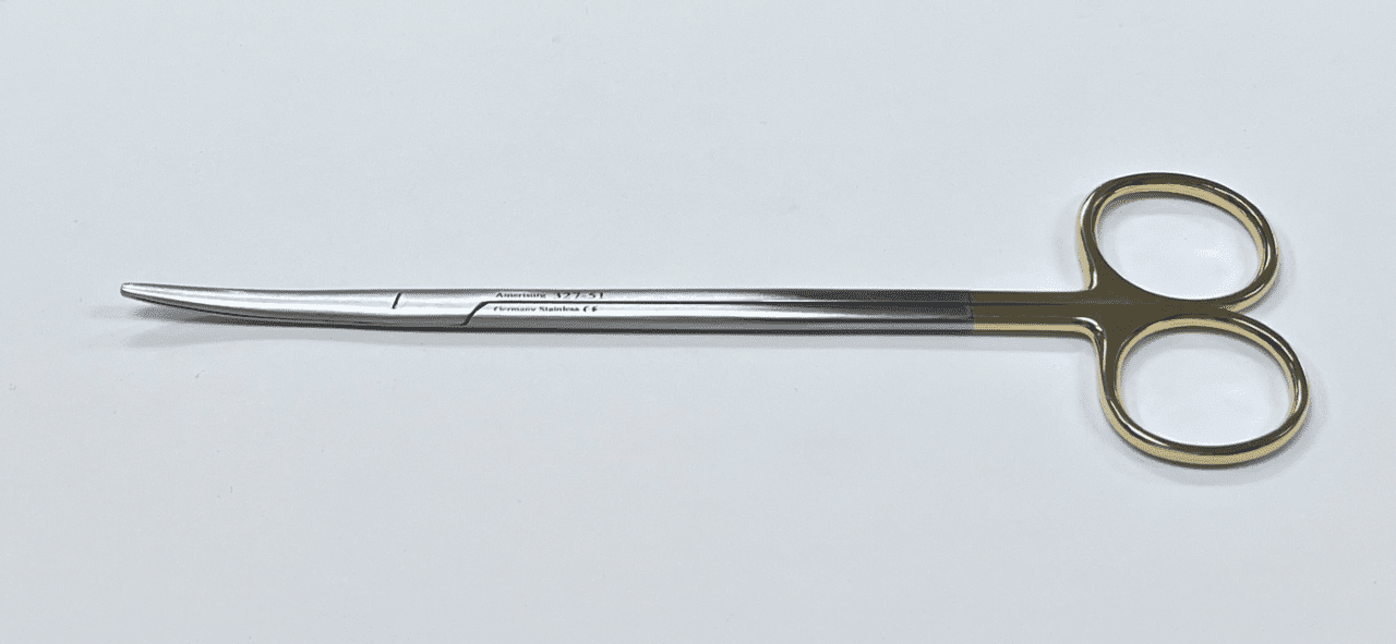 A pair of surgical scissors on a white surface.