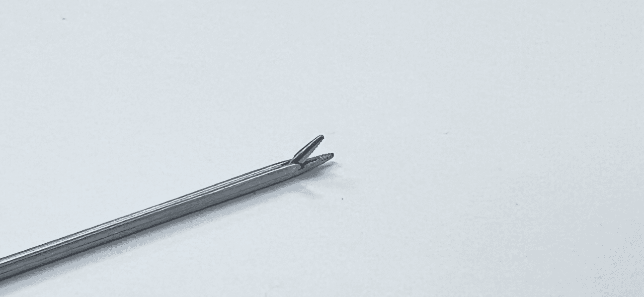A HOUSE MINI FORCEP on a white surface.