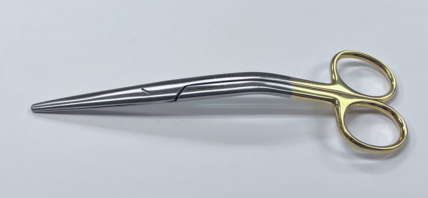 A pair of scissors on a white surface.