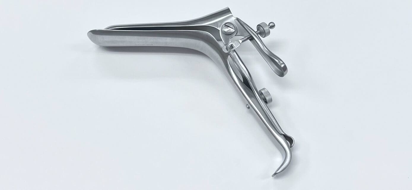 A WEISMAN-GRAVES VAGINAL SPECULUM, RIGHT SIDE OPENING handle on a white surface.