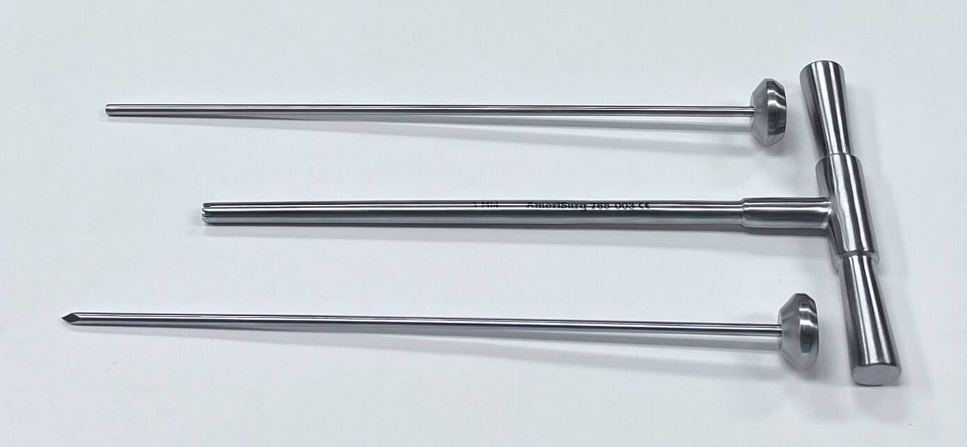 A set of three BONE BIOPSY KIT, 3MM on a white surface.