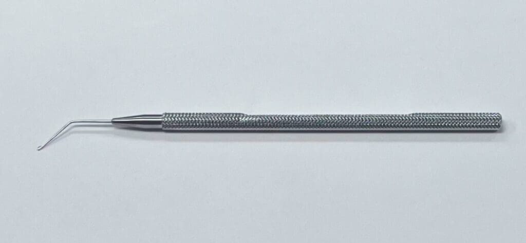 A DRYSDALE NUCLEUS MANIPULATOR is sitting on a white surface.