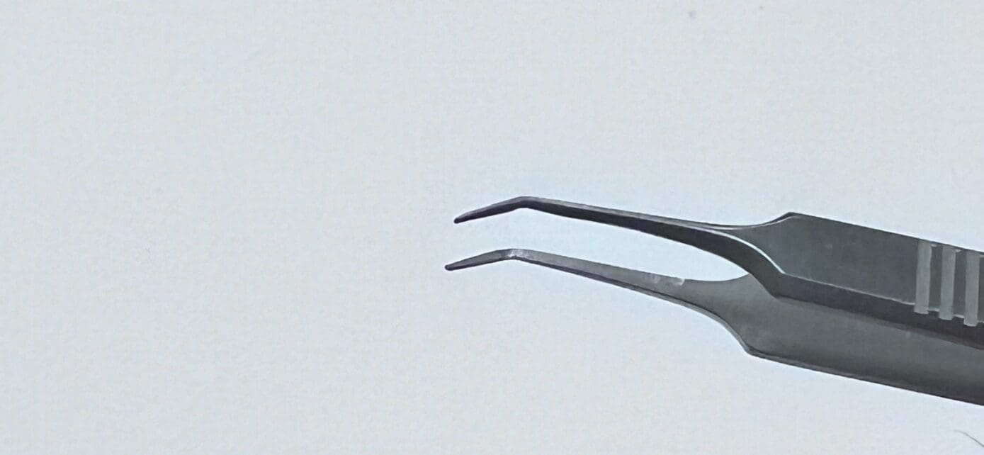A pair of MCPHERSON TYING FORCEP against a white background.