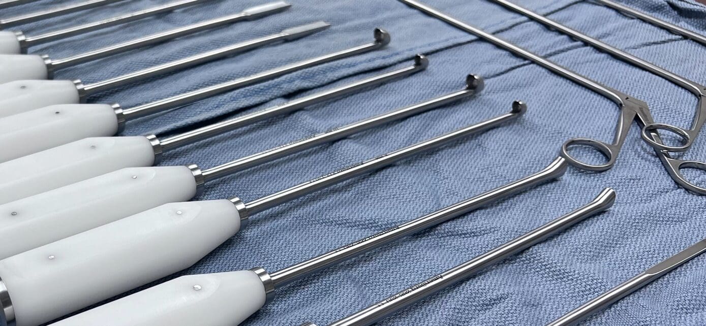 A group of metal objects on a blue cloth.